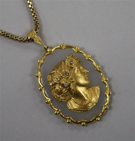 A yellow metal and diamond set chalcedony cameo style oval pendant, with a 9ct gold chain, pendant 54mm.